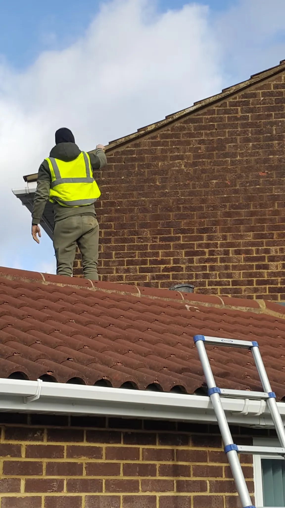 Roofer on ladder